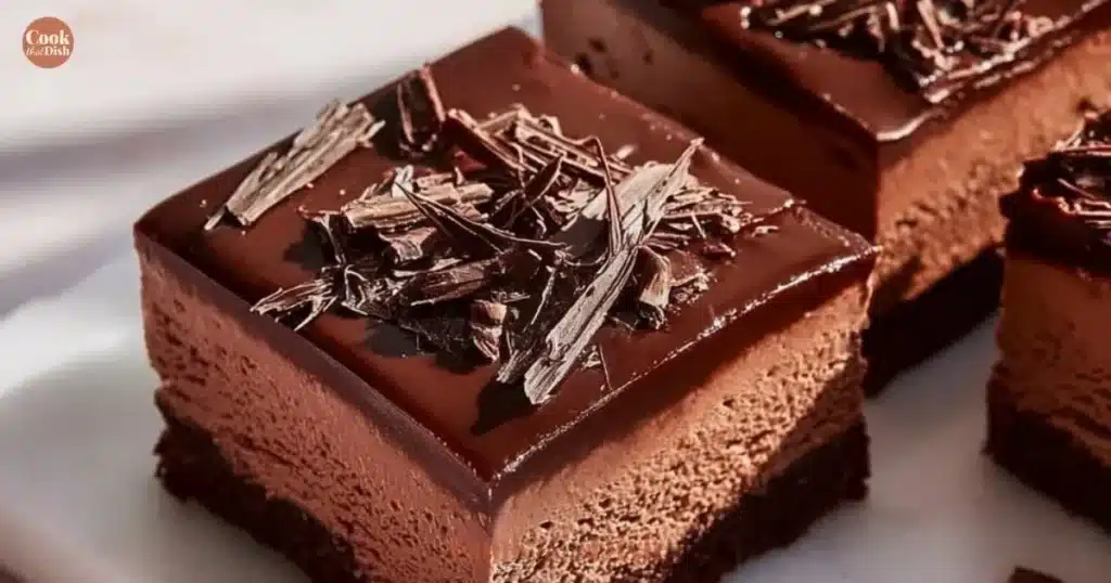 Delicious Chocolate Mousse Brownies topped with chocolate shavings