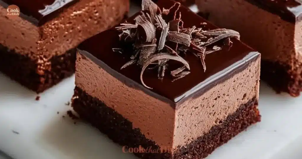 Delicious chocolate mousse brownies topped with creamy chocolate mousse