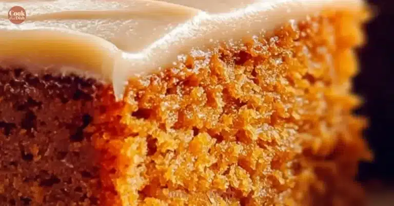 Delicious Southern sweet potato cake topped with creamy frosting and pecans.