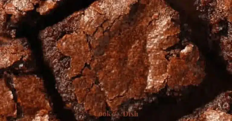 A plate of easy-to-make brownies with chocolate drizzle and nuts