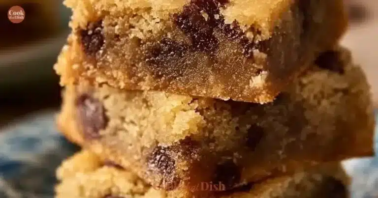 Melt-in-your-mouth chocolate chip cookie bars freshly baked on a cooling rack.