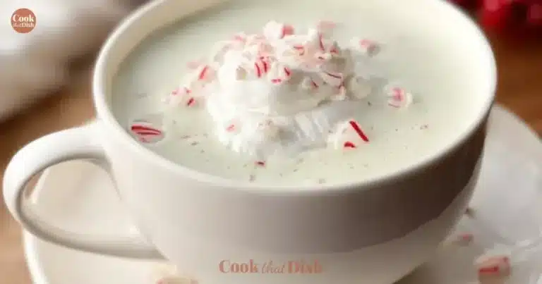 Homemade peppermint tea latte in a cozy mug with whipped cream on top