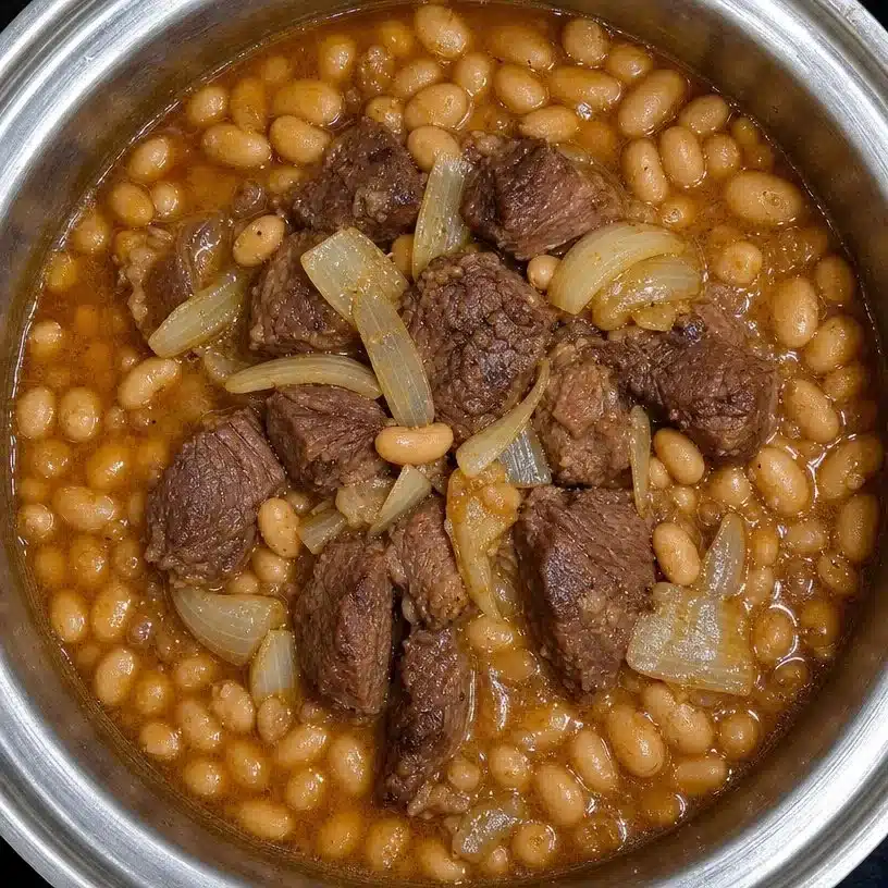 Crockpot Ham and Beans dish served in a bowl, showcasing rich flavors and textures.